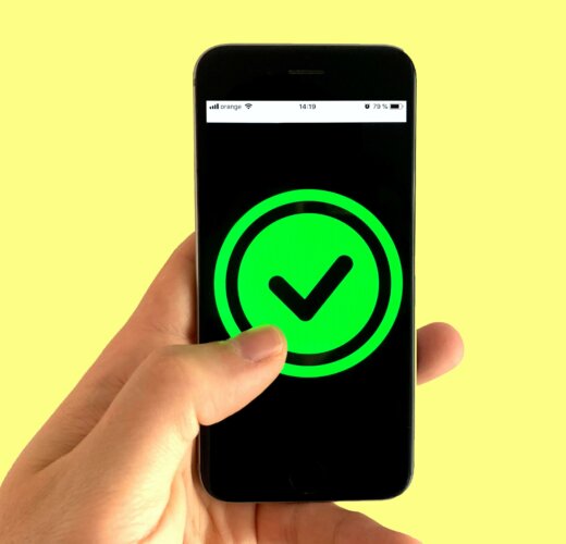 Phone displaying green check mark