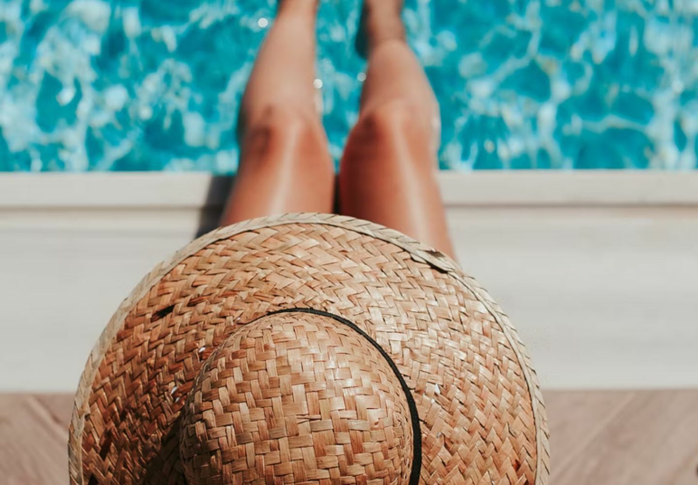 Woman in hat by pool